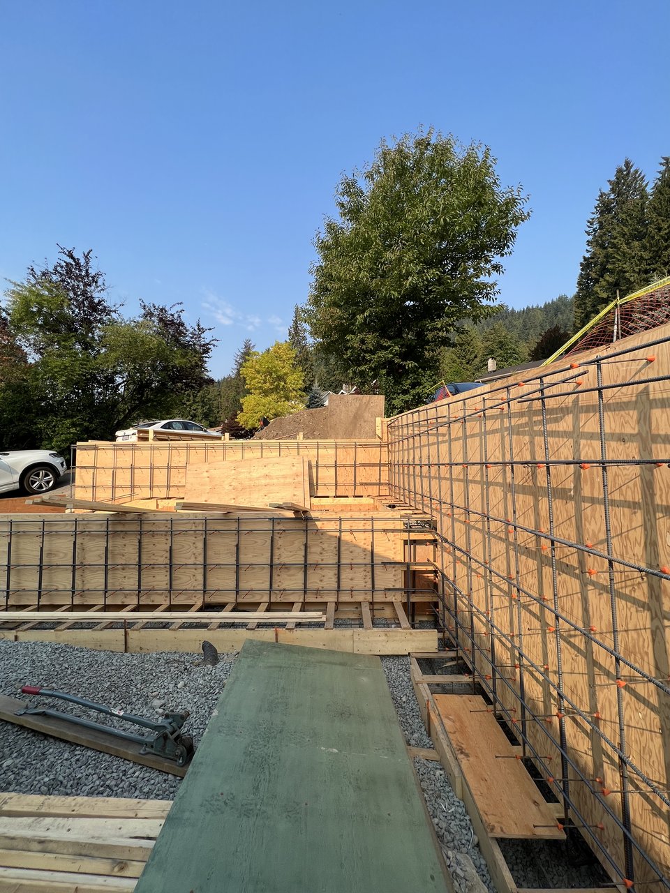Retaining wall forms and reinforcement on a sloped North Vancouver lot