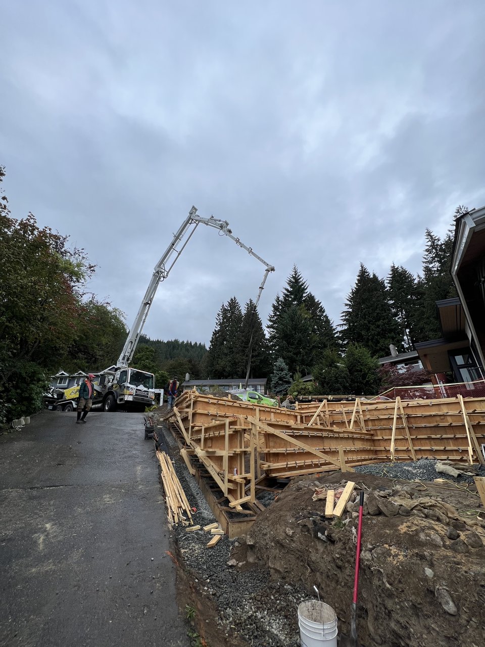 Concrete pump truck placing a foundation pour on a Mulder Contracting site in North Vancouver, BC
