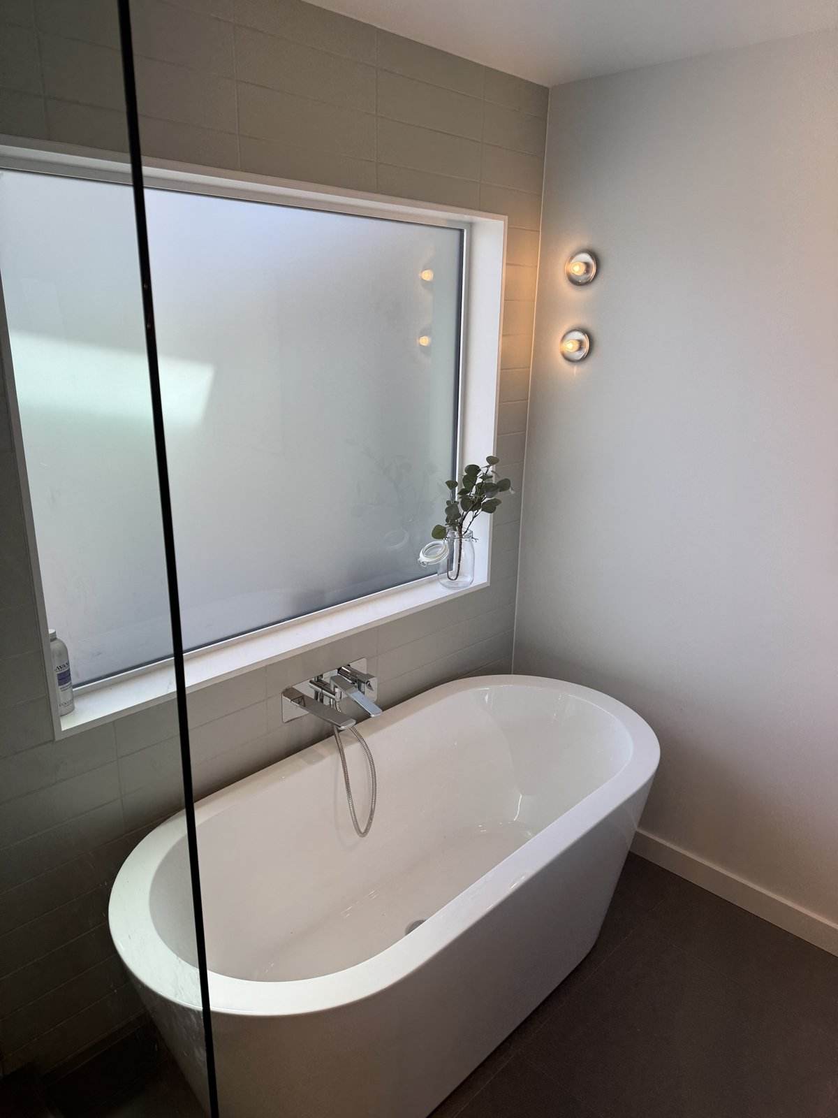 Freestanding soaker tub in a custom home ensuite, North Vancouver